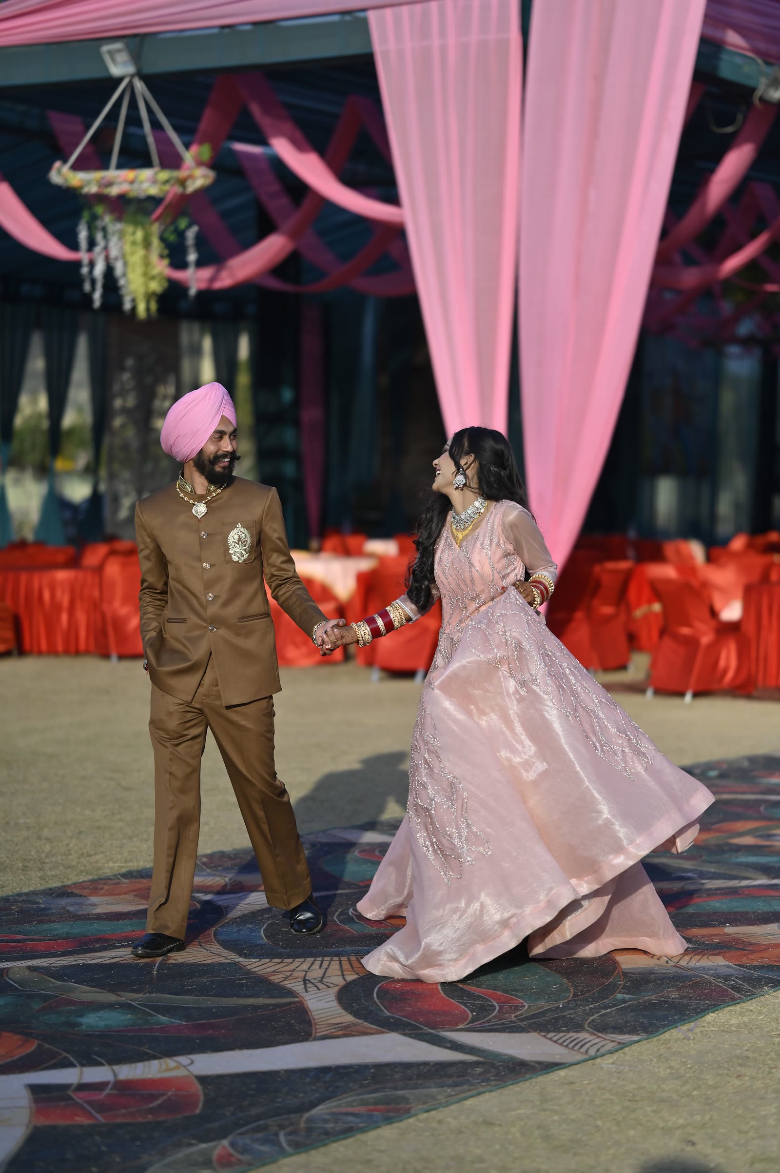 A couple dancing together on the floor at an evening function